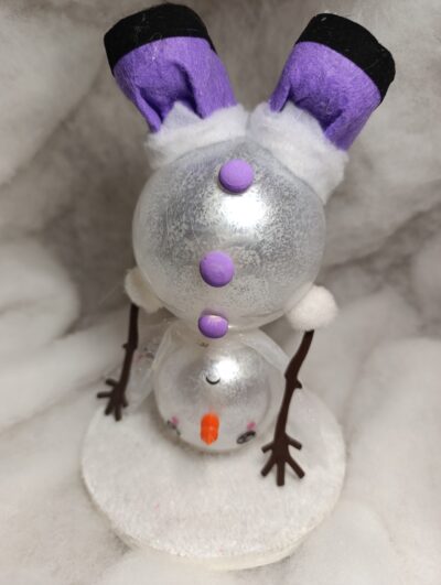 « FlipFlocon Bonhomme de neige acrobate tête en bas »